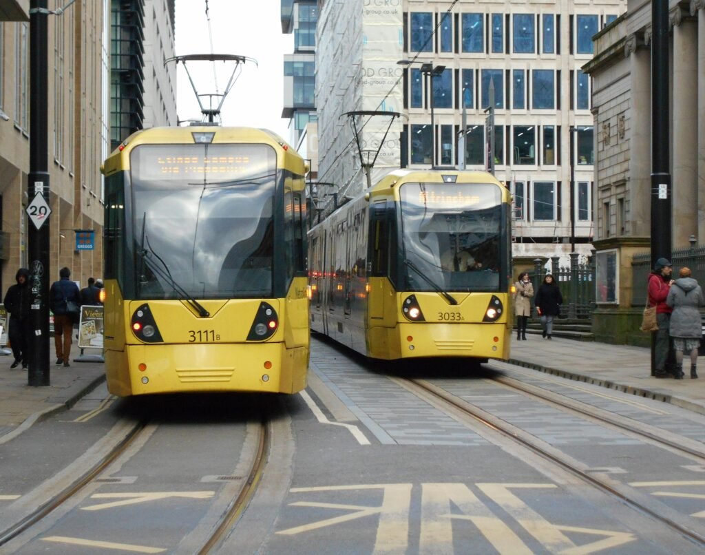 Two M5000 trams passing